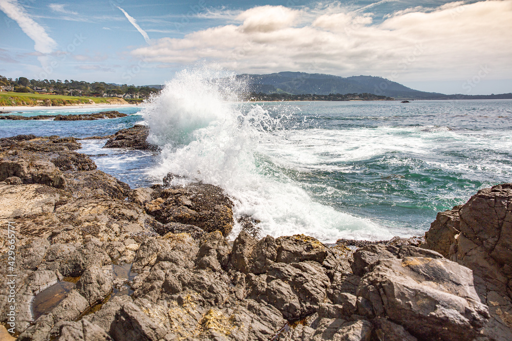 The Pacific Ocean coast in the city of Monterey in California. United States of America. Beautiful beach on a sunny day. Ocean landscape. The Pacific Ocean coast in the city of Monterey in California. United States of America. Beautiful beach on a sunny day. Ocean landscape.