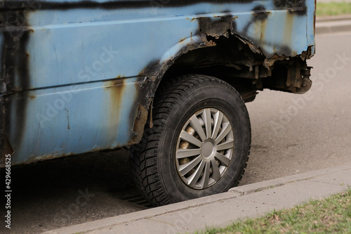 Close up of rusty wheel of old car © glebcallfives