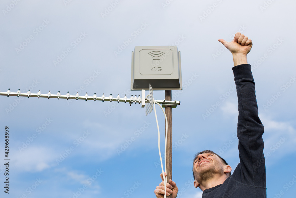 Man Install Antenna And Showing Thumb Up Good 4G Signal Installing 4G man-install-antenna-and-showing-thumb-up-good-4g-signal-installing-4g