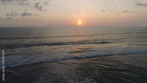 aerial view sunset over ocean. seascape. colorful sunset over sea in tropics. Flying over surface sea at sunset. aerial seascape ocean surface. Travel concept