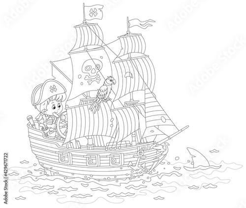 Little boy pirate steering ...