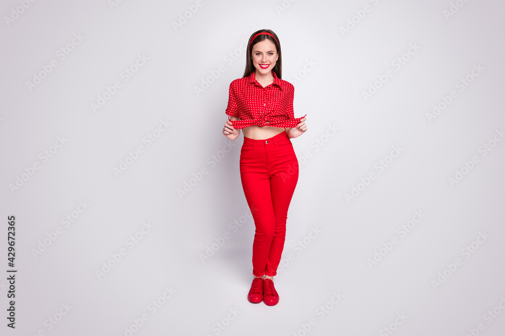 Full length body size view of attractive cheerful glad funky girl posing isolated over grey pastel color background Full length body size view of attractive cheerful glad funky girl posing isolated over grey pastel color background