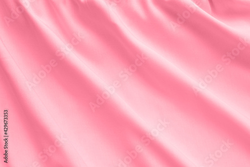 Pink silk texture, abstract background luxury fabric with wavy folds
