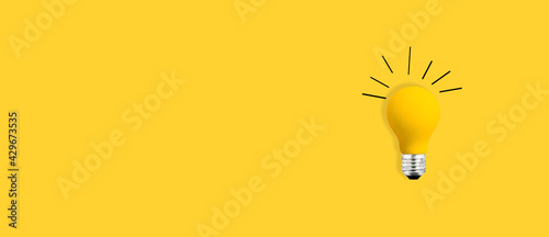 Yellow light bulb - flat lay from above