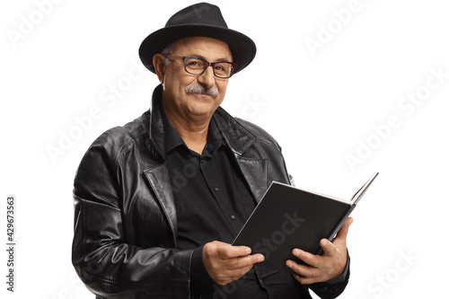 Elderly man with a tophat reading a book