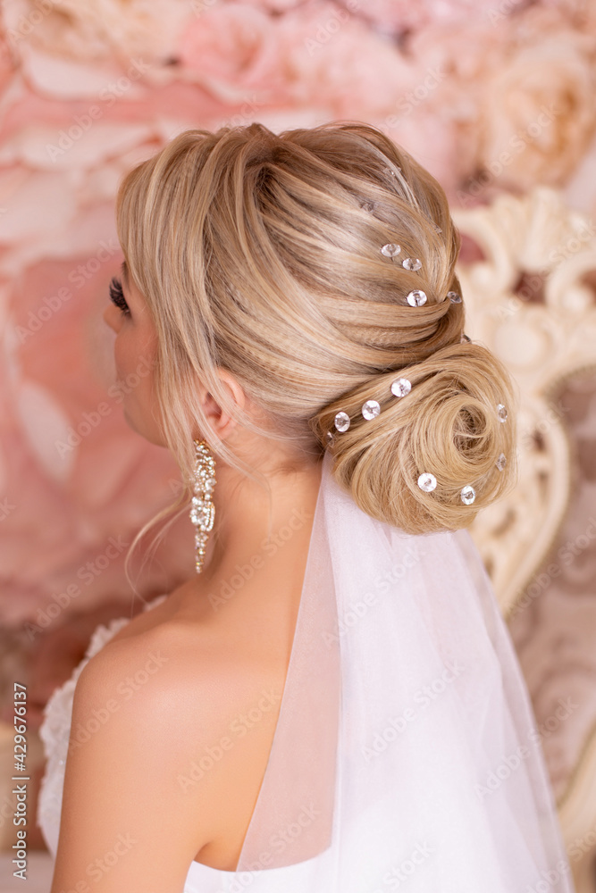 Bride back with blonde wedding hairstyle