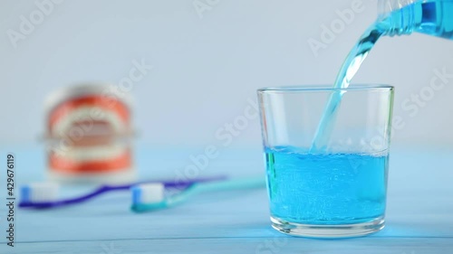 mouthwash on the table in a glass. Oral care