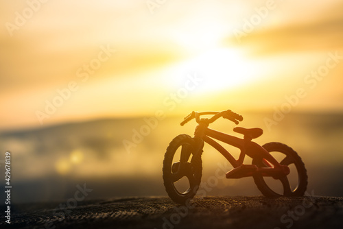 mountain bike on the background of the sunset, outdoors. Sports extreme bicycle