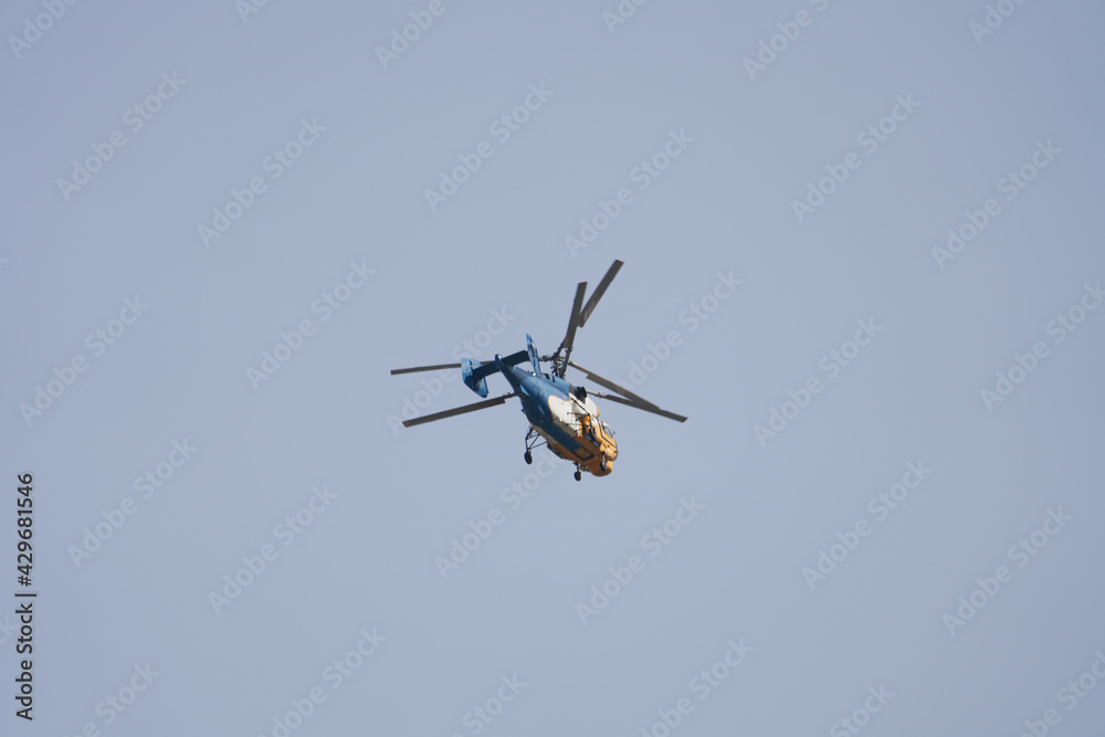 A lone helicopter in the air. Copy space. Blurred in motion. A lone helicopter in the air. Copy space. Blurred in motion.