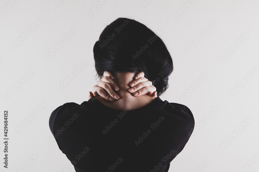 close-up on a woman's hand massaging her neck. Girl's neck hurts close-up on a woman's hand massaging her neck. Girl's neck hurts