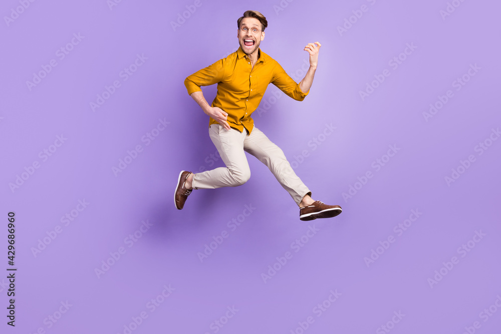 Full body portrait of cheerful person open mouth hands play guitar look camera isolated on purple color background