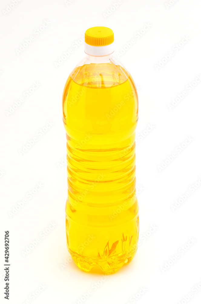 Bottle with vegetable oil on a white background Bottle with vegetable oil on a white background