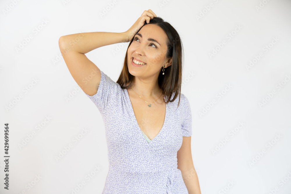 Portrait of a pensive beautiful young woman wearing casual clothes standing isolated over white background Portrait of a pensive beautiful young woman wearing casual clothes standing isolated over white background