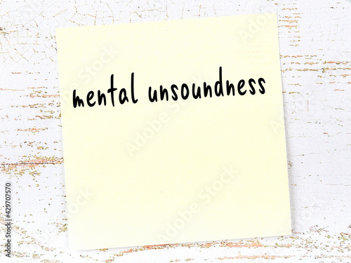 Fotografía Yellow sheet of paper with word mental unsoundness
