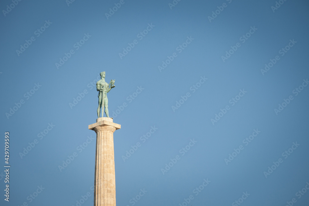 Close up on the Victor statue on Kalemegdan fortress, during a sunny afternoon in Belgrade, Serbia. Also called Viktor Pobednik, Located in Kalemegdan fortress, it's a landmark of the city Close up on the Victor statue on Kalemegdan fortress, during a sunny afternoon in Belgrade, Serbia. Also called Viktor Pobednik, Located in Kalemegdan fortress, it's a landmark of the city