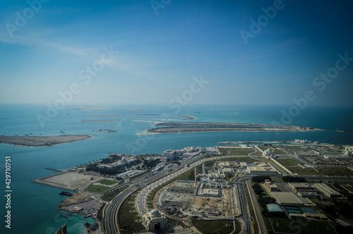Canvas Print Bird's eye and aerial drone view of Abu Dhabi city from observation deck