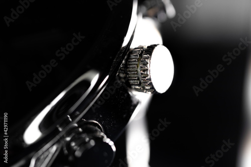 Silhouette Macro Photo of Chronograph Crown and Pushers
