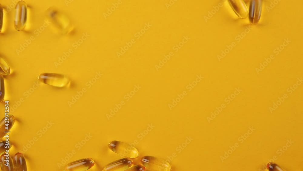 Omega 3 capsules on an orange background. Food supplements, vitamins. Omega 3 capsules on an orange background. Food supplements, vitamins.