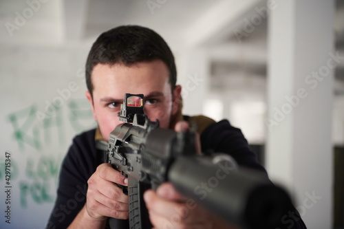 special agent soldier aiming wearing casual clothing