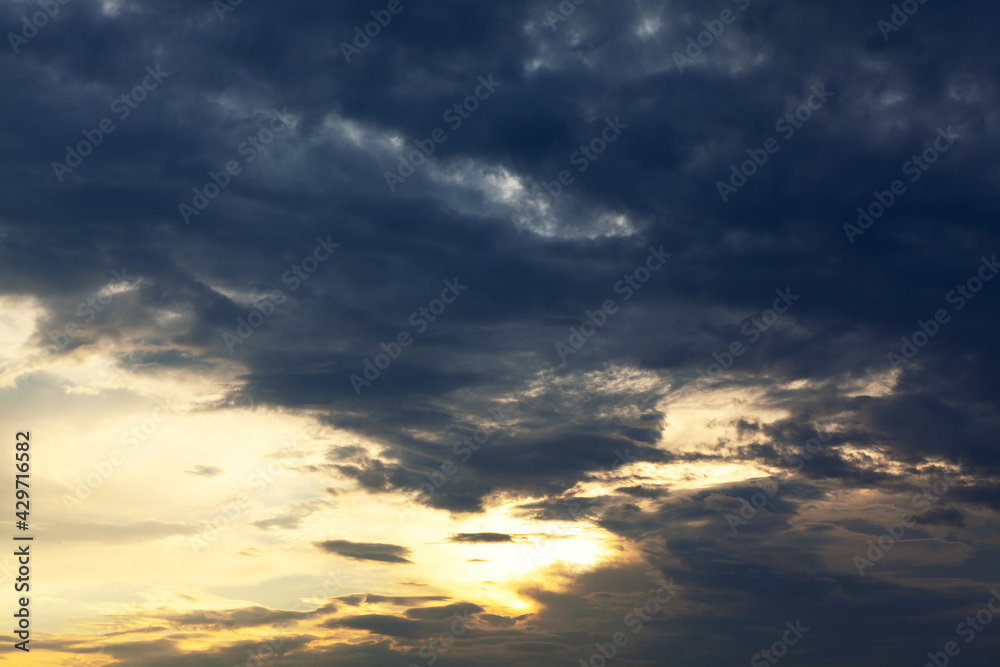 Fototapeta premium Clouds in contrast . Darkness and brightness on the sky