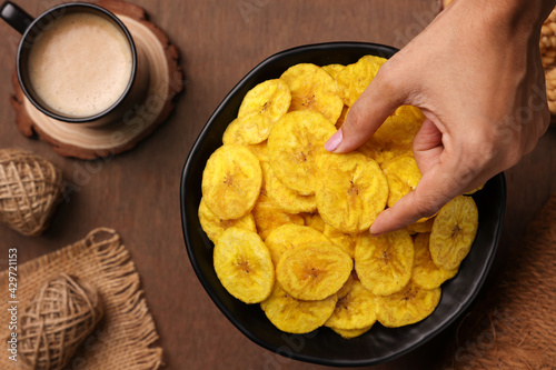 banana chips, popular Kerala snack deep fried in  coconut oil. traditional South Indian tea time snack on banana leaf, Kerala India on Onam, Vishu, Diwali, Ramzan photo