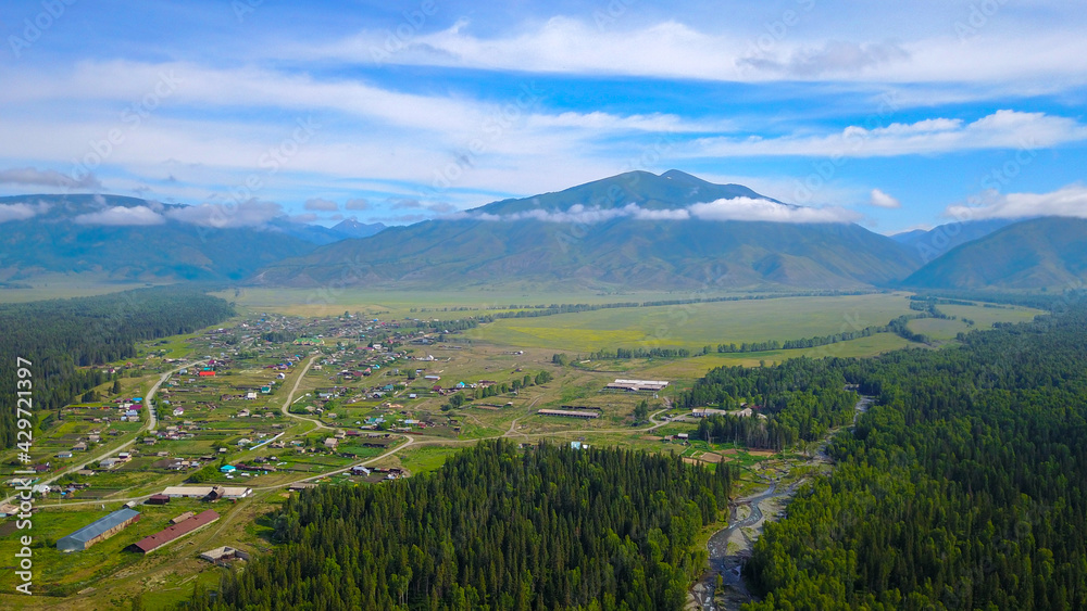 Aerial view of the Katanda valley overlooking the village, mountain range and the river, Altai photo by drone
