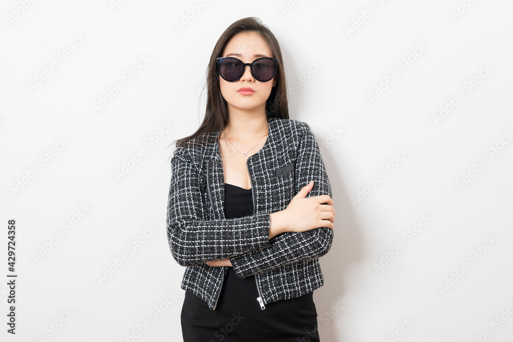 Beautiful Asian businesswoman with sunglasses on white background. Beautiful Asian businesswoman with sunglasses on white background.