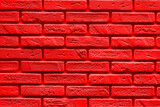 Red Background is made of artificial stone. Side view, indoors horizontal shot.