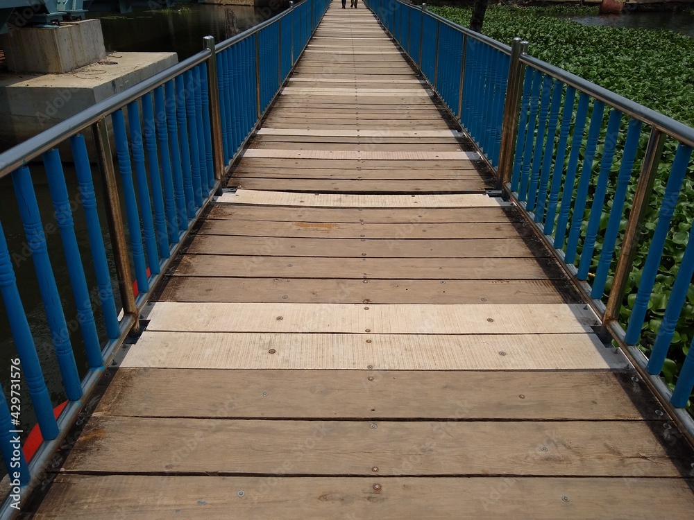 wooden bridge in the park, flotting pathway in Veli lake, Veli tourist village, Thiruvananthapuram Kerala
