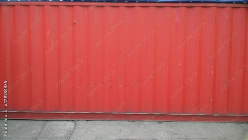 Foreman walking and using laptop computer checklist inventory and control loading Containers box at warehouse logistic in Cargo freight ship for import export. shipping loading in docks. Foreman walking and using laptop computer checklist inventory and control loading Containers box at warehouse logistic in Cargo freight ship for import export. shipping loading in docks.