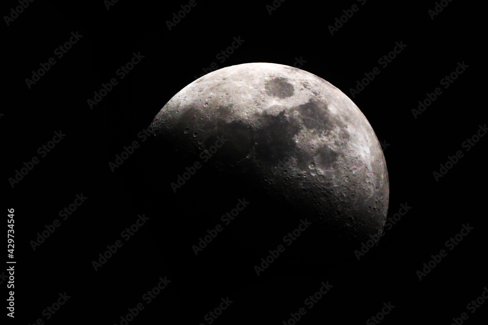 Half Moon Background / The Moon is an astronomical body that orbits planet Earth, being Earth's only permanent natural satellite Half Moon Background / The Moon is an astronomical body that orbits planet Earth, being Earth's only permanent natural satellite