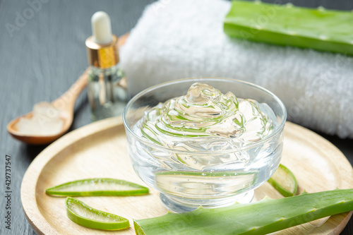 Aloe vera cosmetic cream on dark background