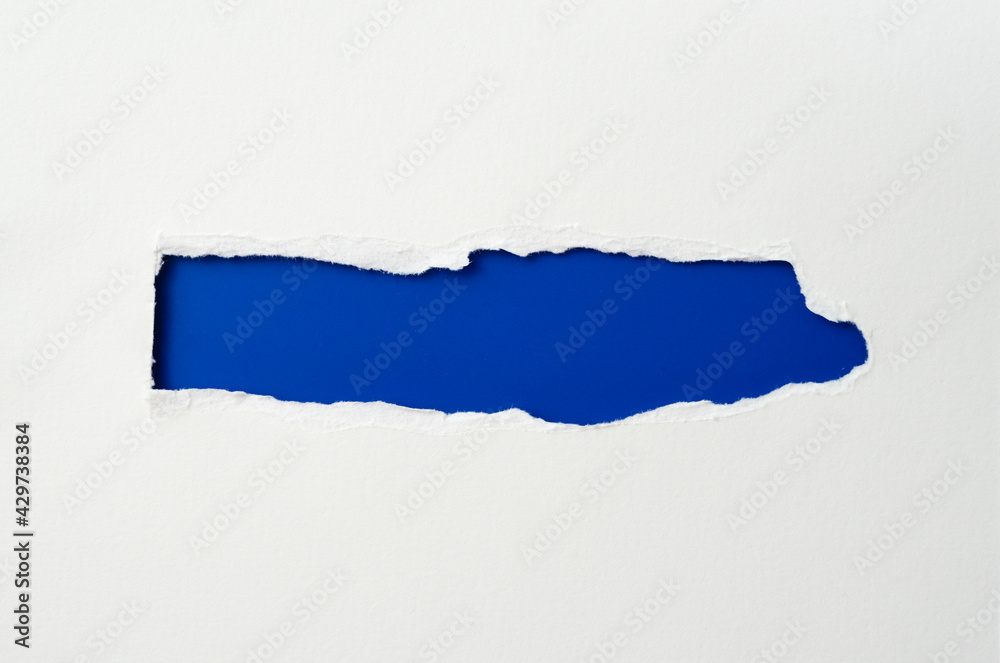 torn paper frame with the ripped sides. a blue hole of torn on the white paper. realistic torn paper with the ripped edges for copy space and text. torn paper frame with the ripped sides. a blue hole of torn on the white paper. realistic torn paper with the ripped edges for copy space and text.
