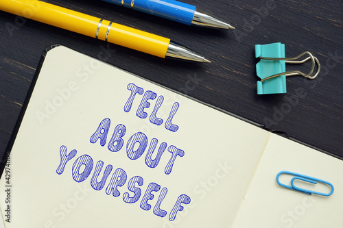 Business concept about TELL ABOUT YOURSELF with inscription on the piece of paper. photo