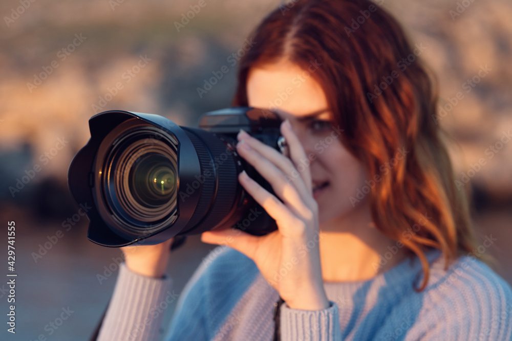 woman with camera and in blue sweater in mountains outdoors cropped view woman with camera and in blue sweater in mountains outdoors cropped view