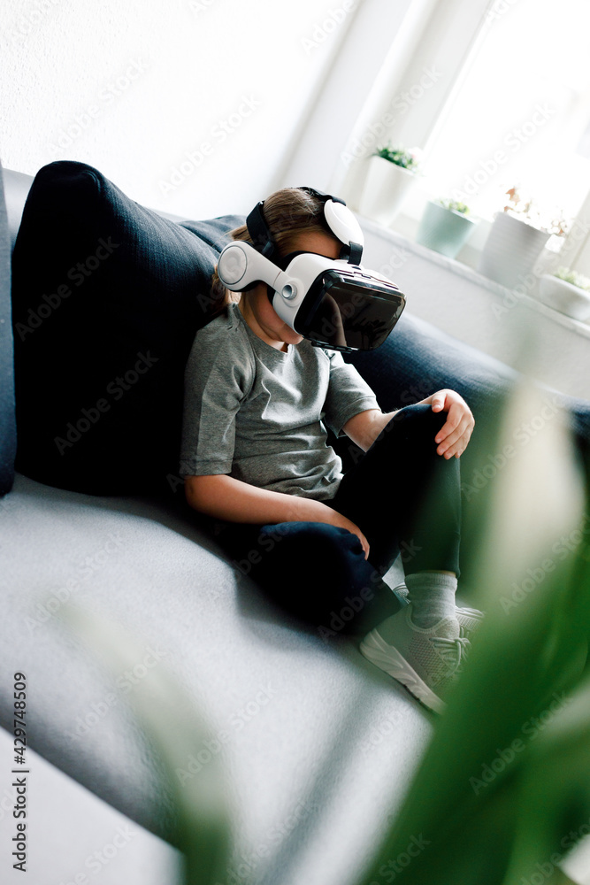Fototapeta premium Child in virtual augmented reality helmet
