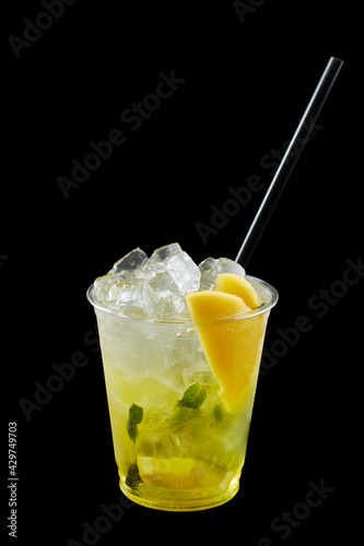 Summer Drink Fresh Lemonade in the plastic cup, black background, isolate