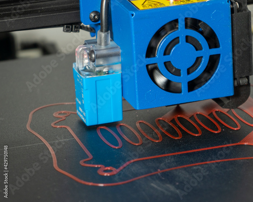 a 3d printer at work creating a custom 3d model
