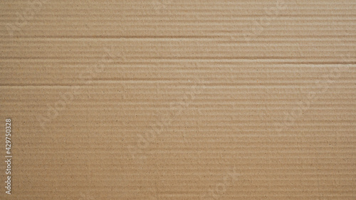 Cardboard texture, Paper box or packing paper, Brown horizontal corrugated and folded use for background, Close up