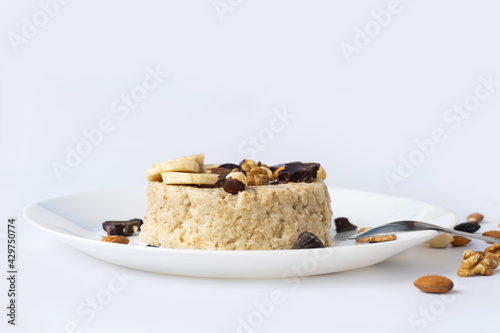 Oatmeal with fruit, chocolate and honey. Breakfast. photo