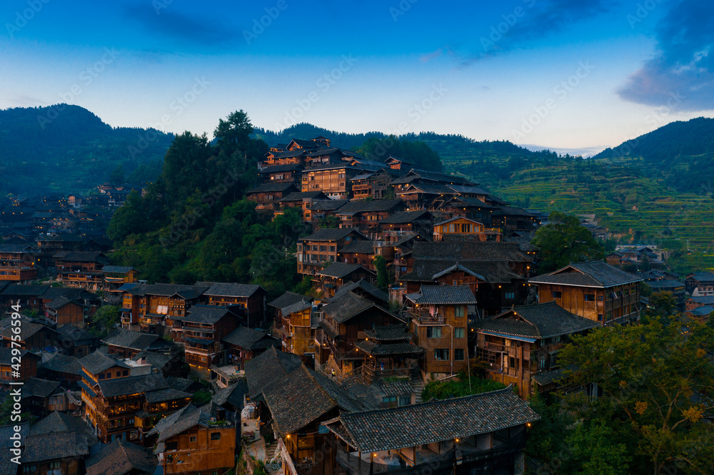 Obraz premium Night view of Qianhu Miao village in Xijiang, Qiandongnan, Guizhou Province, China