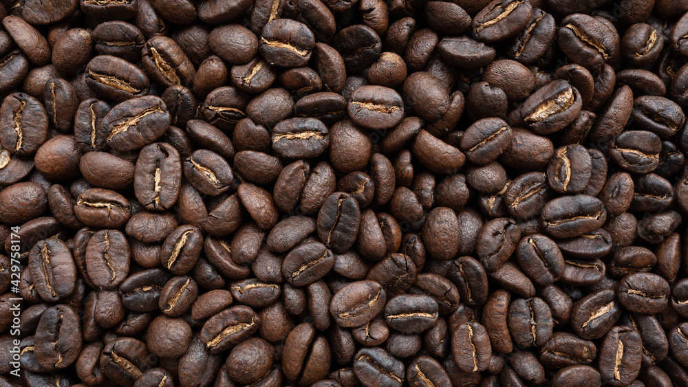 Obraz premium Roasted arabica coffee bean background
