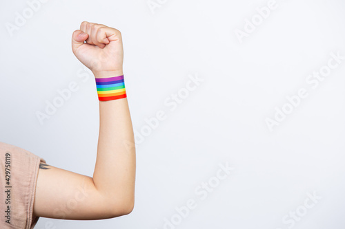 Happy woman with rainbow bracelet LGBT.