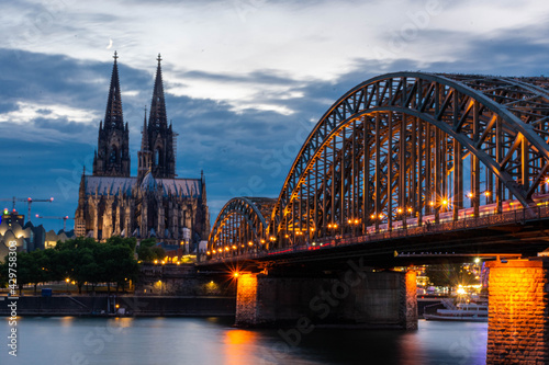 COLOGNE, GERMANY, 23 JULY 2020 Colorful sunset over Cologne Cathedral and Hohenzollern Bridge