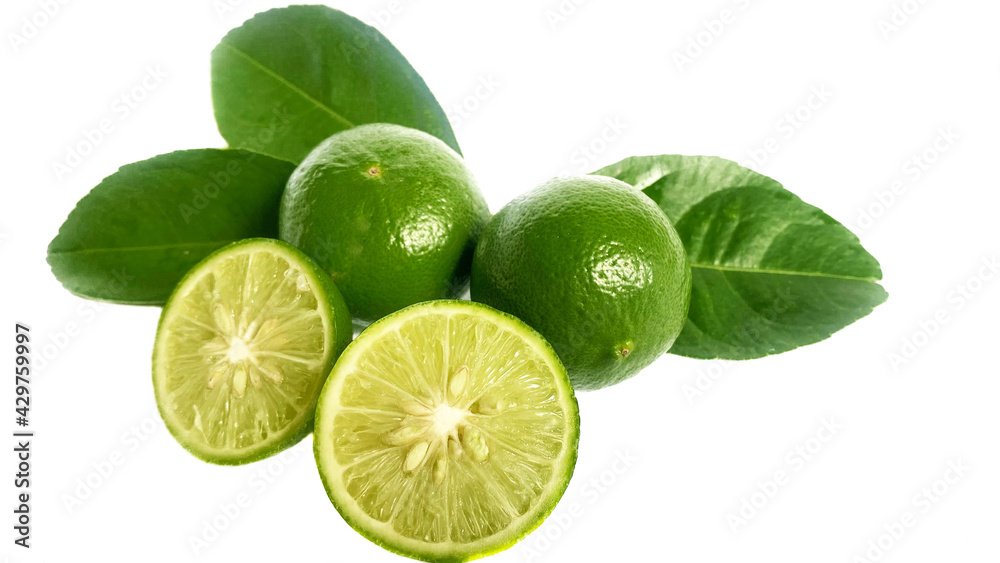 Lime, green rind with leaves on the back, have separate parts. Can see the lemon pulp and seeds separately. On isolated on white background