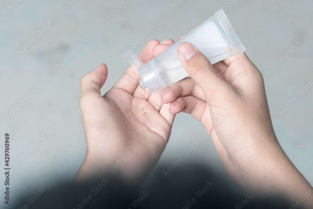 Man hand using alcohol wash gel for cleaning sanitizer gel pump dispenser on white background, health care concept for prevent covid-19 Man hand using alcohol wash gel for cleaning sanitizer gel pump dispenser on white background, health care concept for prevent covid-19