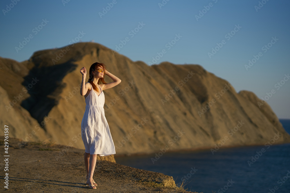 woman near the sea in the mountains travel tourism adventure model