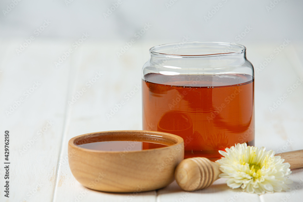 Delicious honey on white wooden backgroud