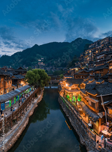 Night view of Qianhu Miao village in Xijiang, Qiandongnan, Guizhou Province, China photo