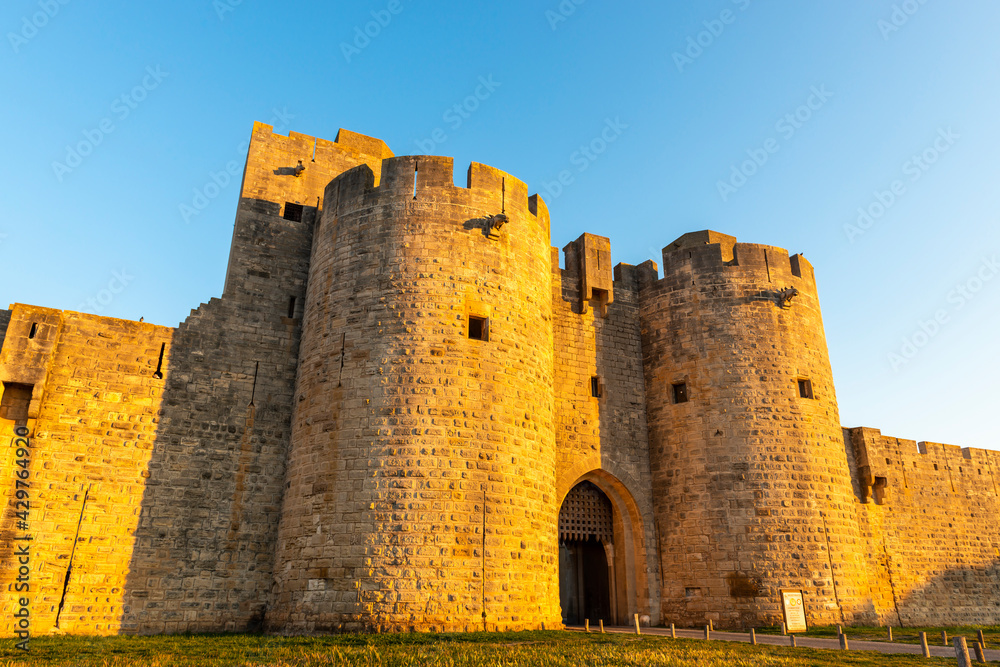 Gate and east ramparts, Aigues-Mortes in the early morning, in the Gard in Occitanie, France